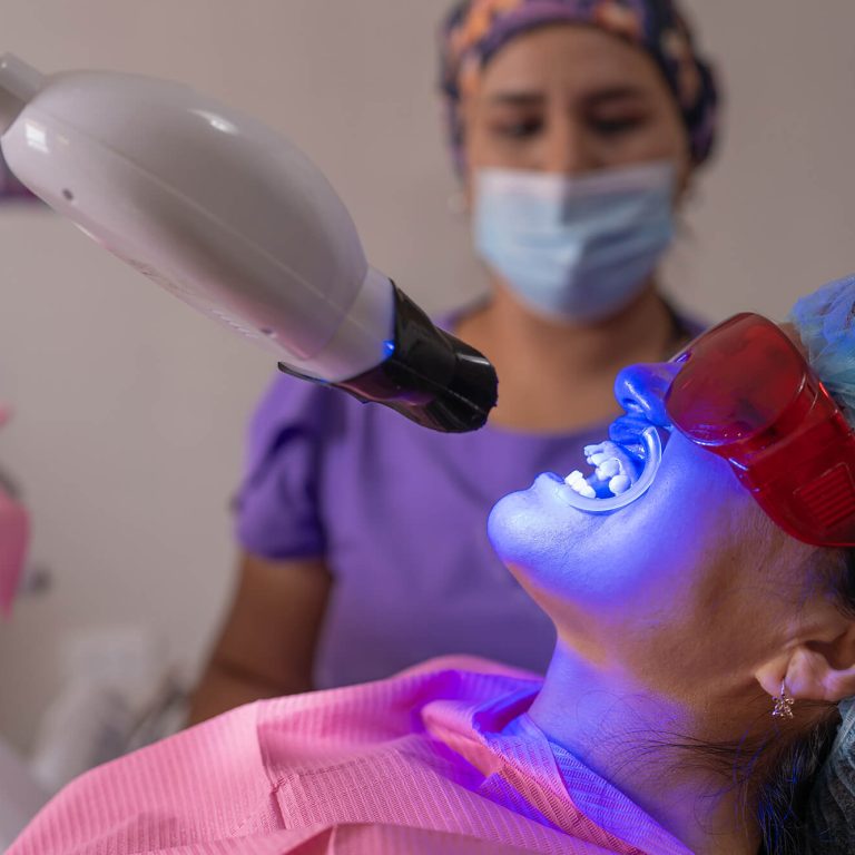 dentist-checking-his-patient-s-cavities-with-a-blu-2025-03-05-16-54-38-utc (1)